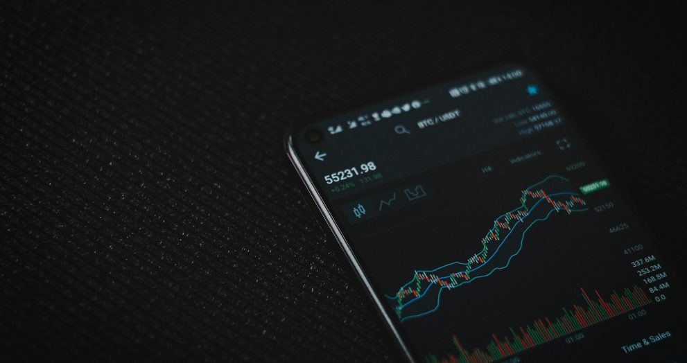 black android smartphone on black textile