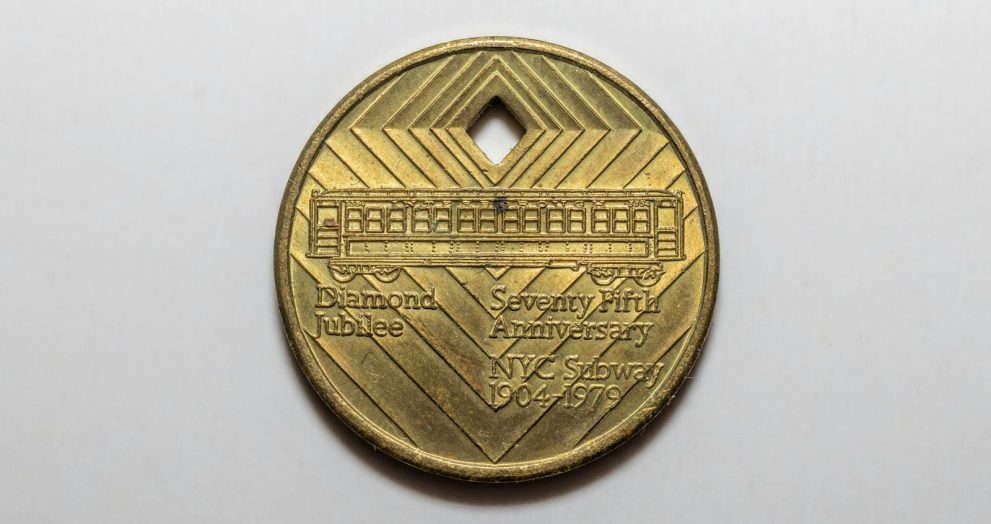 a close up of a coin on a white surface