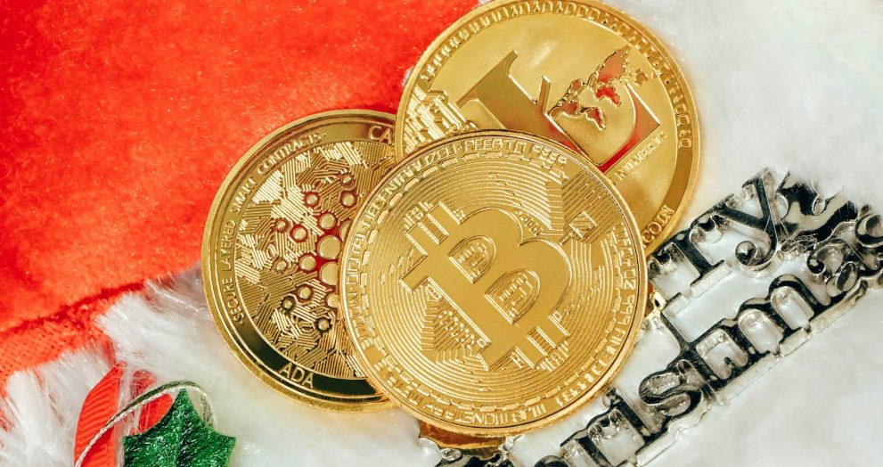two gold bitcoins sitting next to each other